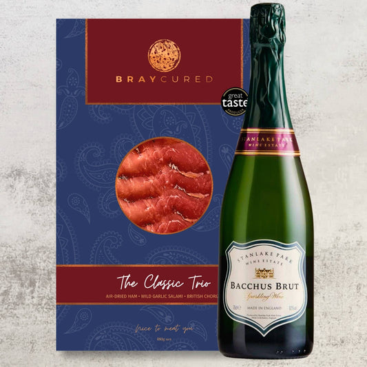 Bray Cured Bacchus Brut and trio of British charcuterie selection in a luxury hamper, featuring cured meats and champagne-style bubbly