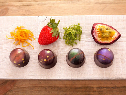 Assorted fruity fondant creams in Gorvett & Stone chocolate gift box, colorful and decorative confections arranged inside.