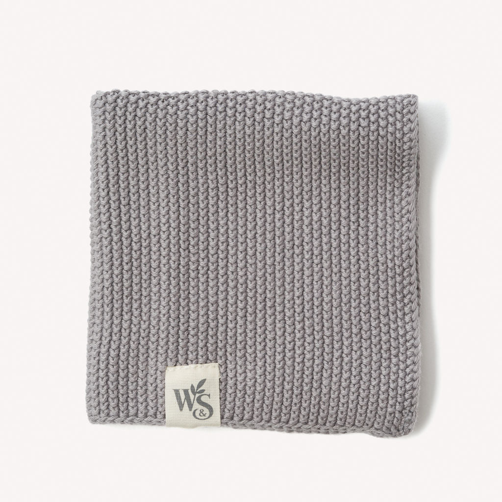 Wild and Stone organic cotton dishcloth showing soft, absorbent fabric with decorative stitching for kitchen use
