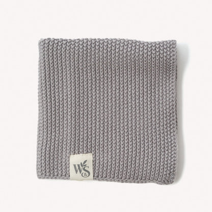 Wild and Stone organic cotton dishcloth showing soft, absorbent fabric with decorative stitching for kitchen use