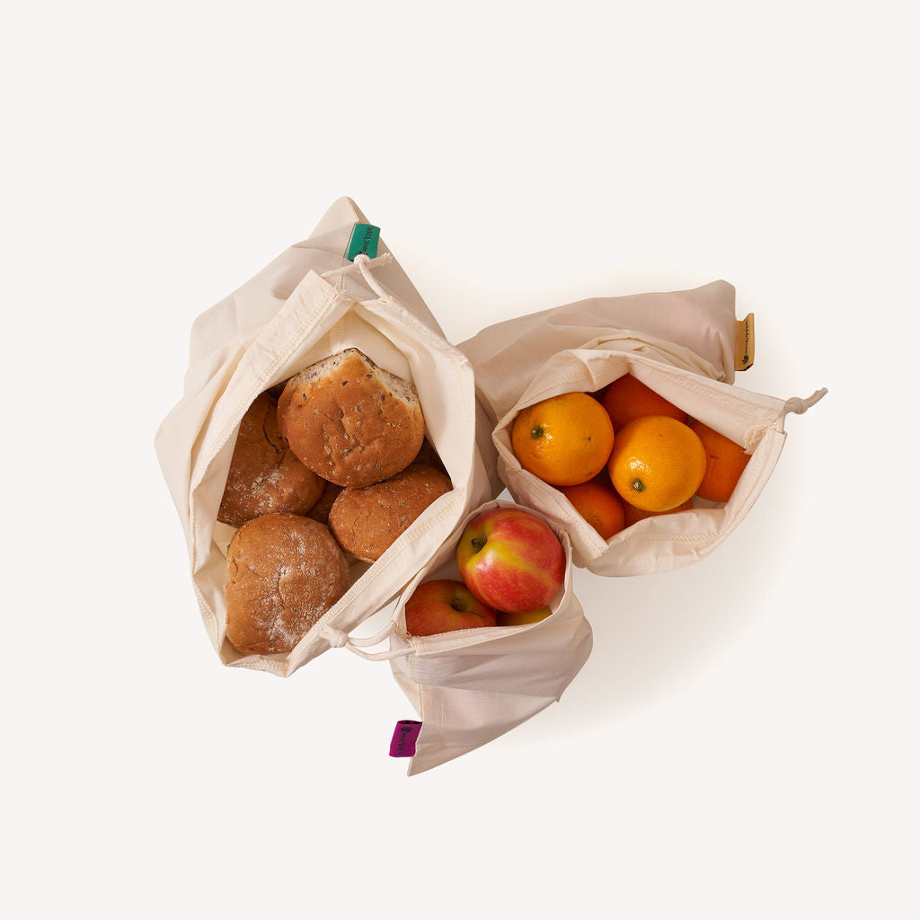 Set of three organic cotton reusable produce bags by Wild And Stone, showcasing lightweight, breathable eco-friendly shopping bags.
