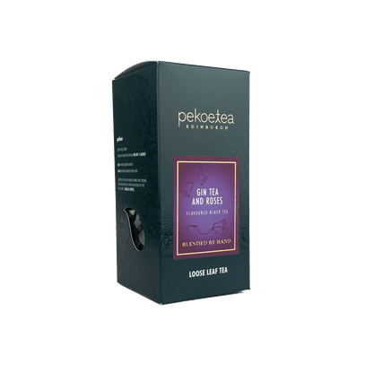 Pekoetea Edinburgh Gin Tea box featuring a floral design with roses and tea leaves, showcasing the elegant packaging.
