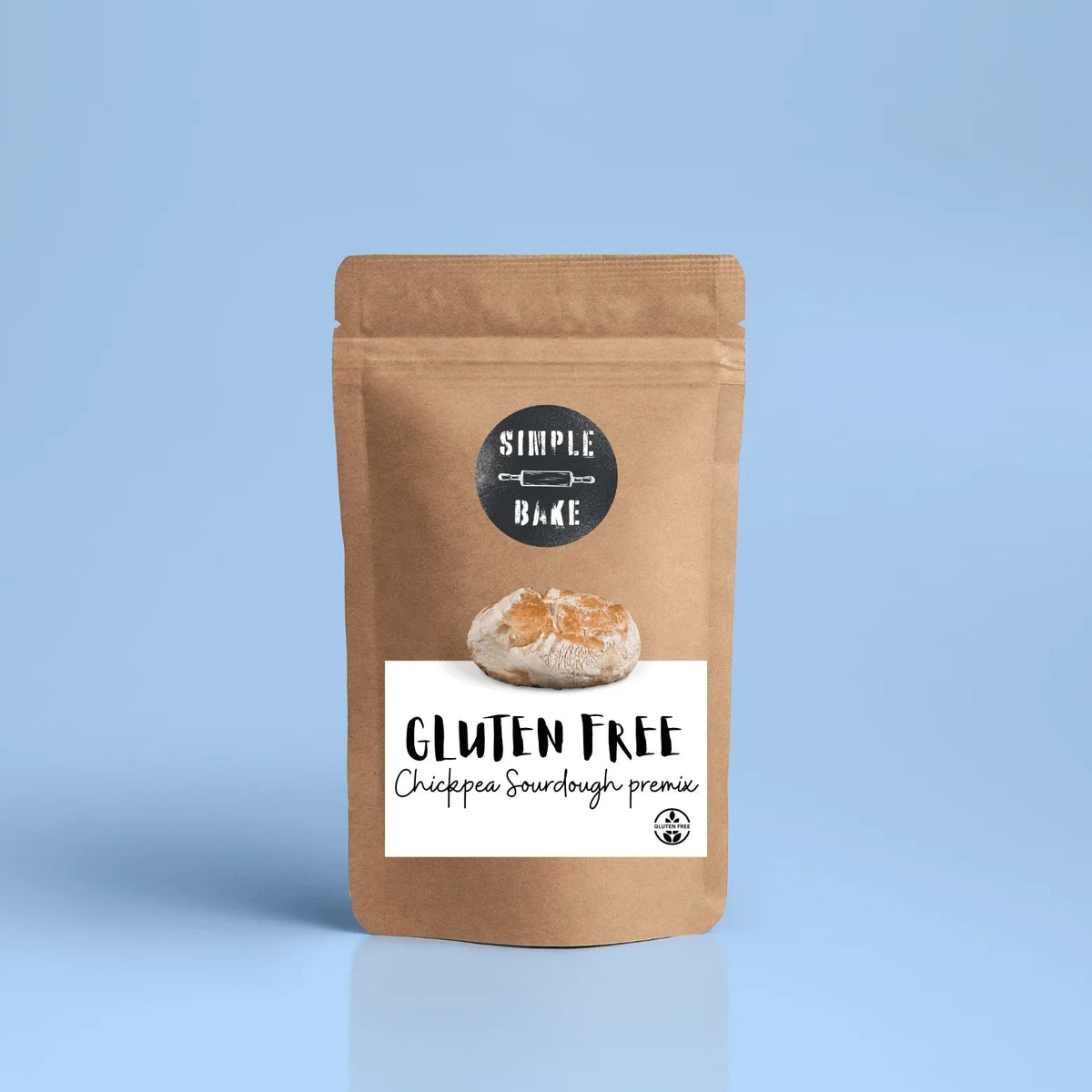 Gluten-free chickpea bread premix by Simple Bake, showing the packaging with a bowl of prepared bread on a wooden surface.