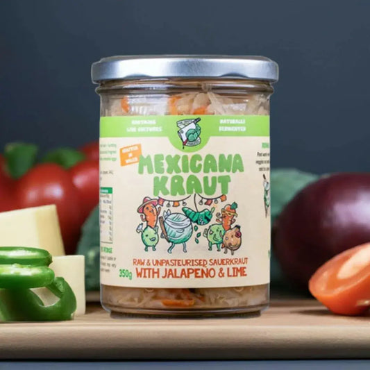 Close-up of a 350g jar of Crafty Pickle Co. Mexicana Kraut, showcasing tangy fermented sauerkraut with shredded vegetables inside.
