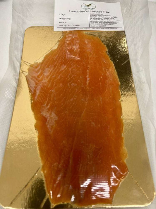 Cold smoked Hampshire trout from Butler Country Estates, sliced and ready to serve, showcasing its rich texture and smoky flavor.