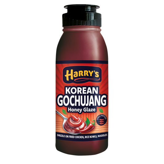 Bottle of Harry's Hot Honey Korean Gochujang Honey Glaze with red and yellow label and a squeeze cap, showcasing Korean-inspired spicy sweet glaze.