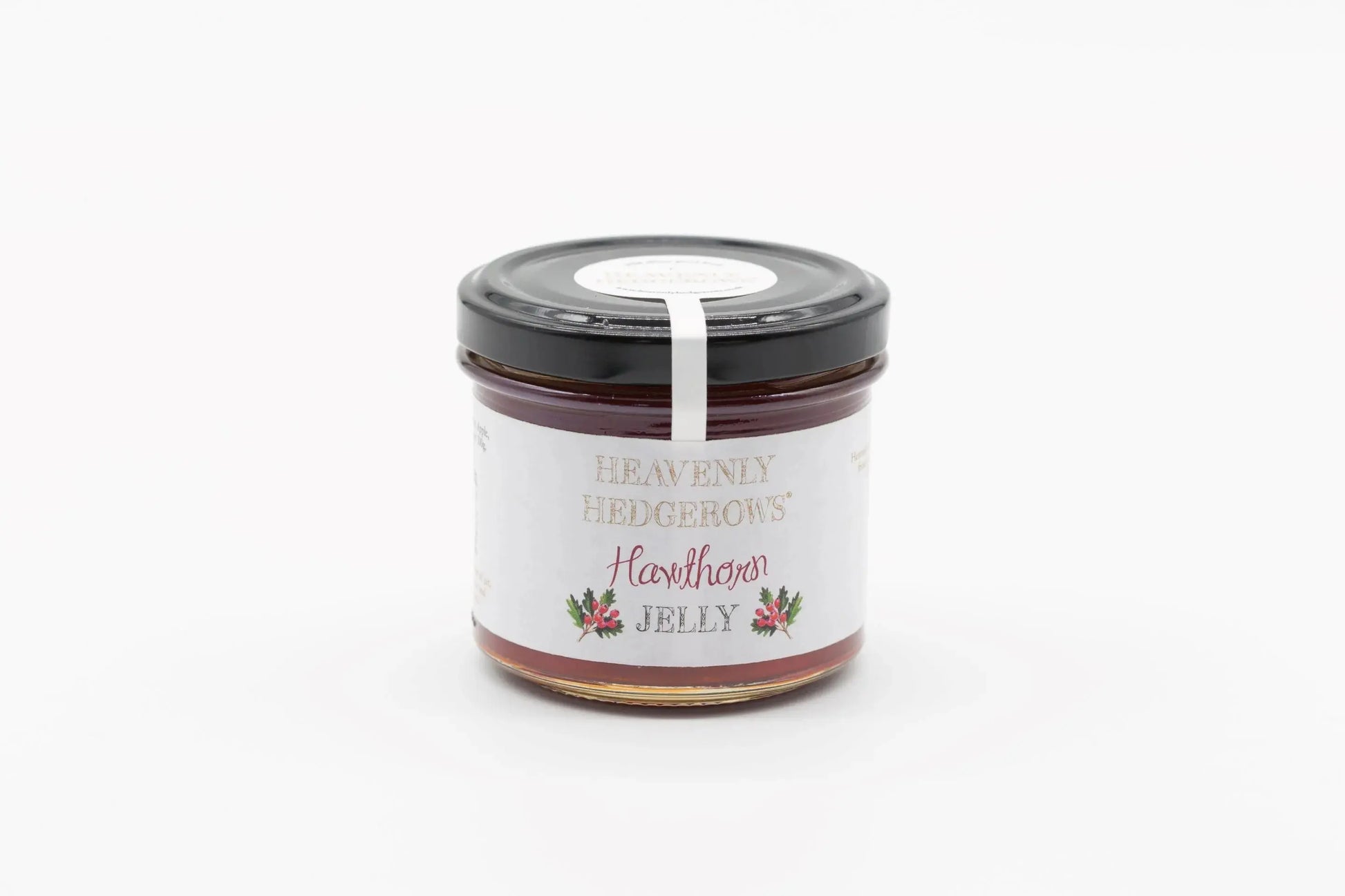 Heavenly Hedgerows Hawthorn Jelly jar with a label, showcasing the rich, deep red color of the jam in a glass jar.