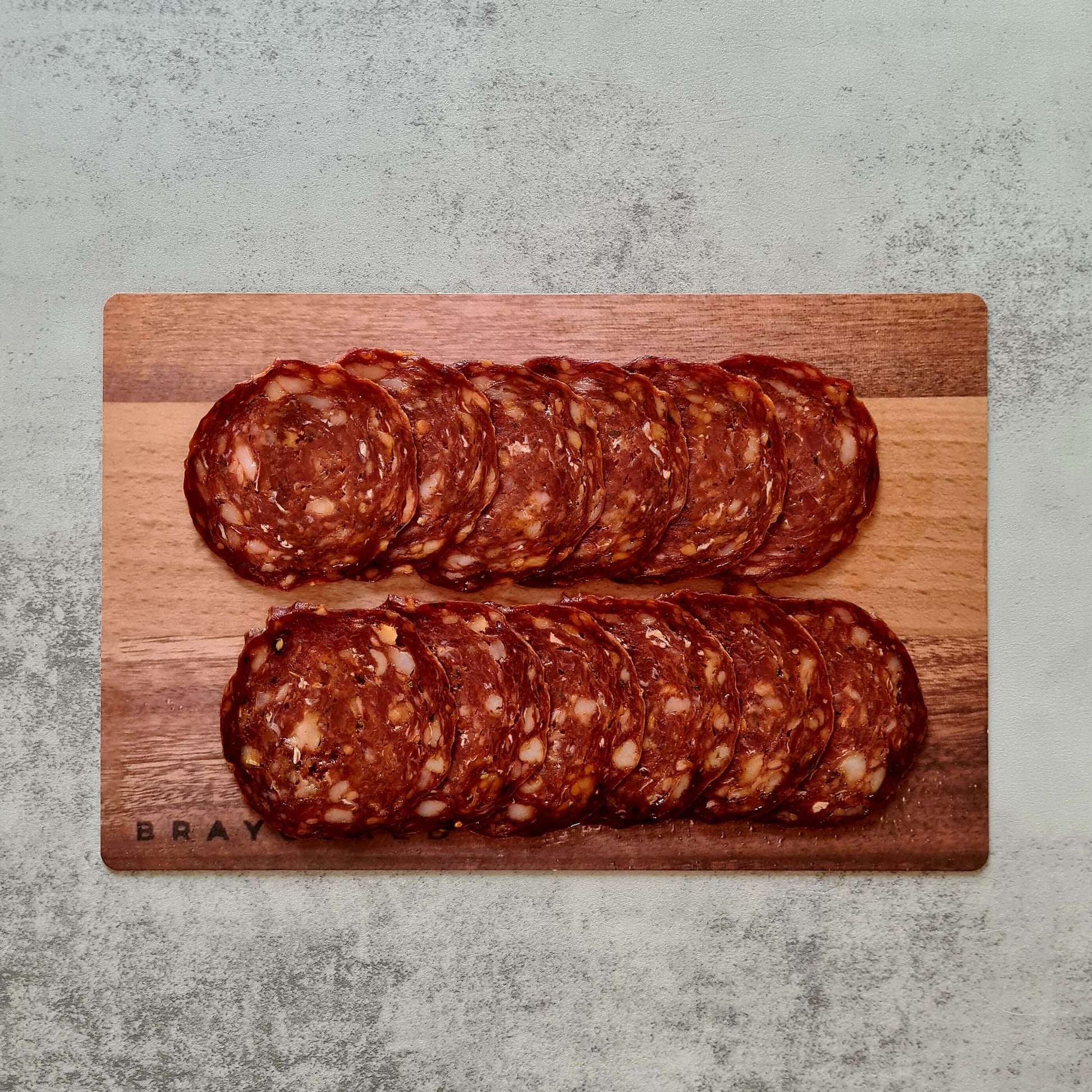 Bray Cured Pizza Charcuterie Pack with hogget chorizo, sliced meats on a wooden board, ready for serving.