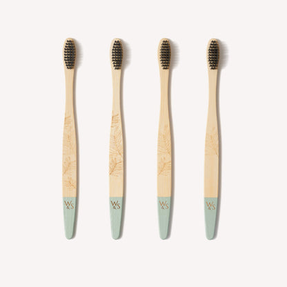 Wild and Stone adult bamboo toothbrushes with medium bristles in a 4-pack, showcasing eco-friendly toothbrushes with natural bamboo handles.