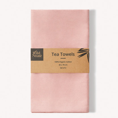 Set of two Wild and Stone organic cotton tea towels with herringbone weave, ideal for kitchen drying and decor.