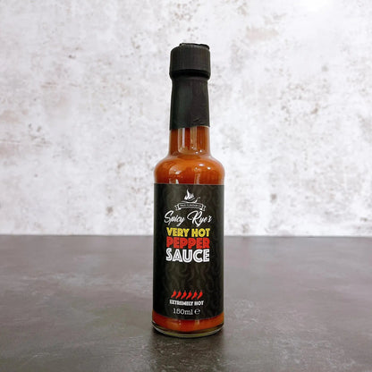 Spicy Ryes Very Hot Pepper Sauce in a small glass bottle with a red label, showcasing fiery red hot sauce inside.