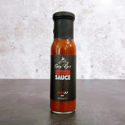Spicy Ryes Original Hot Pepper Sauce bottle with red hot pepper and label, showcasing the spicy hot sauce product.