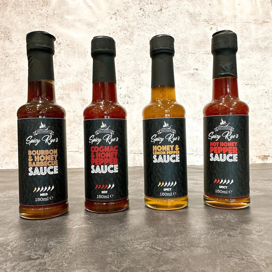 Spicy Ryes Sweet Heat Collection gift set with assorted spicy sauces and condiments in colorful packaging on a wooden table