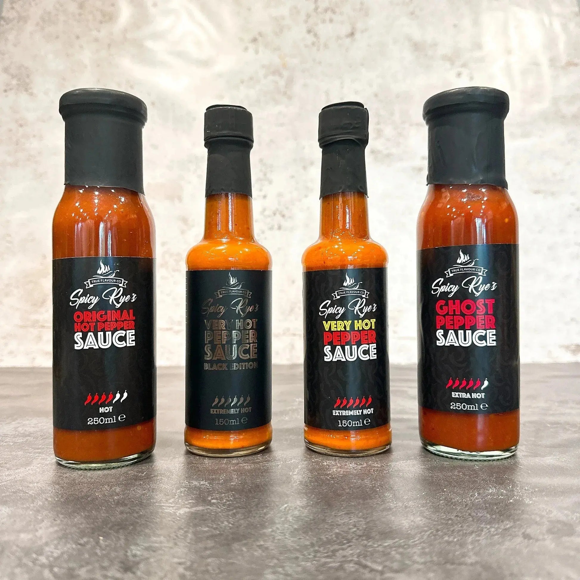 Spicy Ryes Heat Seekers gift set with spicy games and recipes, featuring a colorful collection of hot sauce bottles and gift packaging.