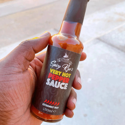 Spicy Ryes Very Hot Pepper Sauce bottle with bright label and fiery peppers, showcasing the hot sauce's spicy and flavorful appearance.