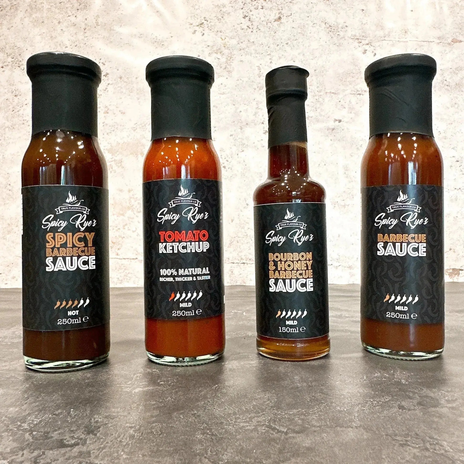 Spicy Ryes Thrill of the Grill Gift Set featuring assorted grilling spices and tools for outdoor barbecue enthusiasts.
