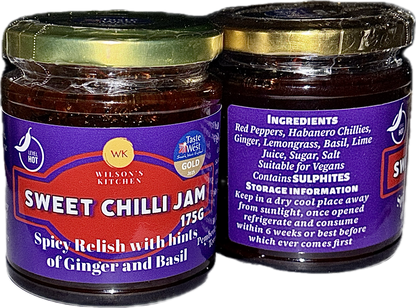 Award-winning Wilson’s Kitchen Hot Sweet Chilli Jam in a jar with a vibrant red-orange appearance and chili peppers visible inside.