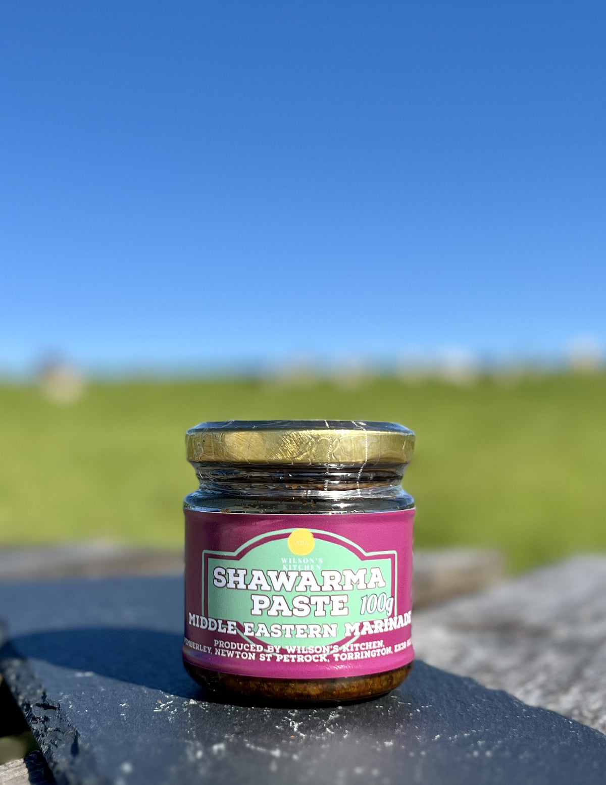 Wilson’s Kitchen Shawarma Paste in a jar, showcasing a rich, reddish spice mixture for flavorful Middle Eastern dishes.