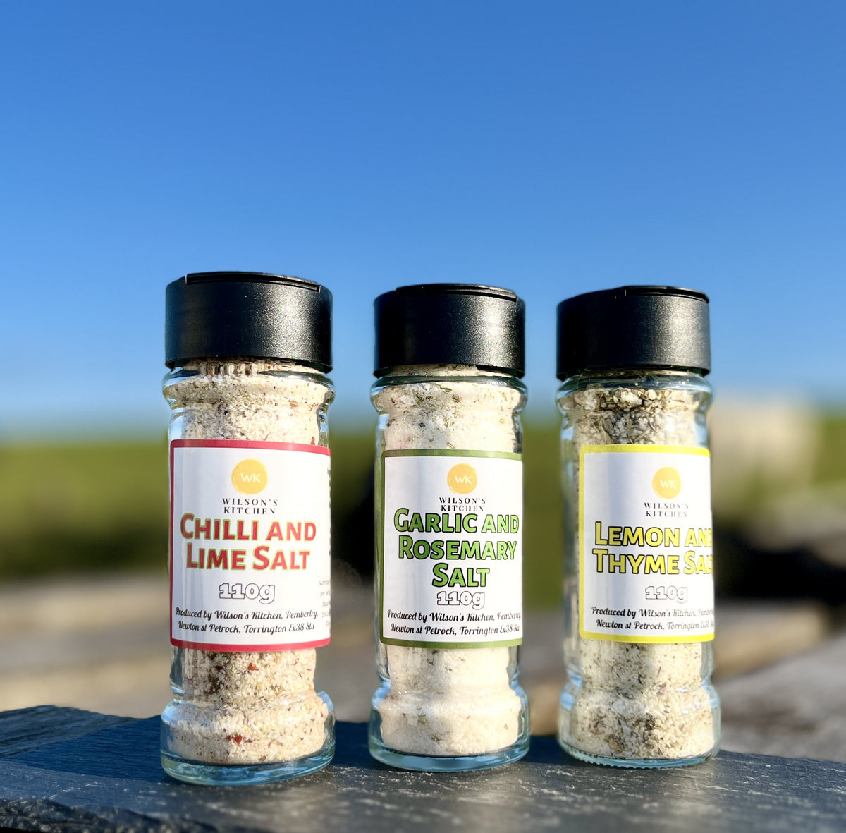 Wilson’s Kitchen chili and lime salt, a cooking ingredient with vibrant chili and lime seasoning in a jar.
