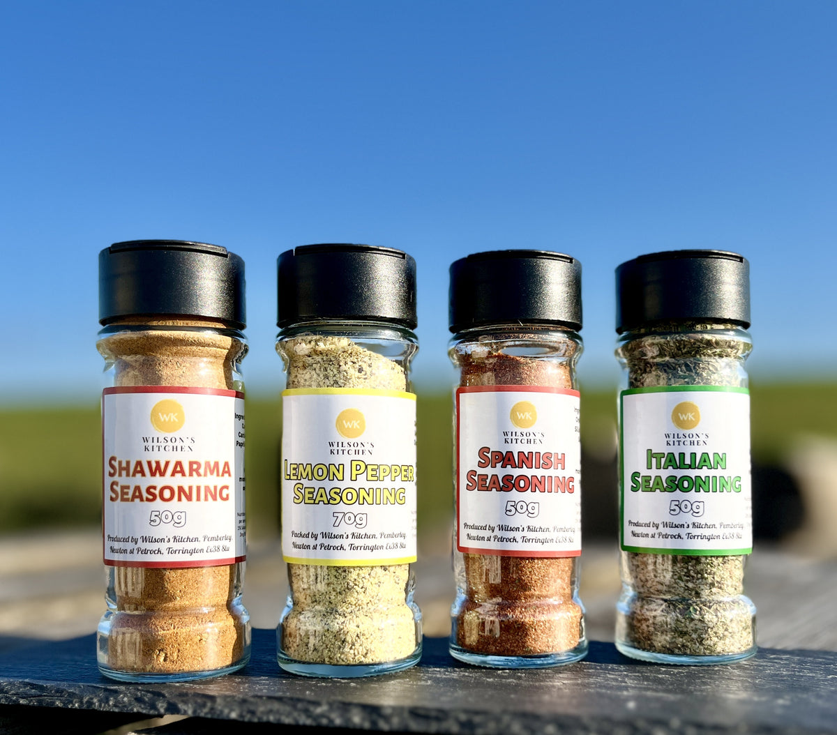 Wilson’s Kitchen Spanish seasoning for cooking, featuring a colorful blend of herbs and spices in a jar.