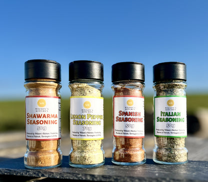 Wilson’s Kitchen Spanish seasoning for cooking, featuring a colorful blend of herbs and spices in a jar.