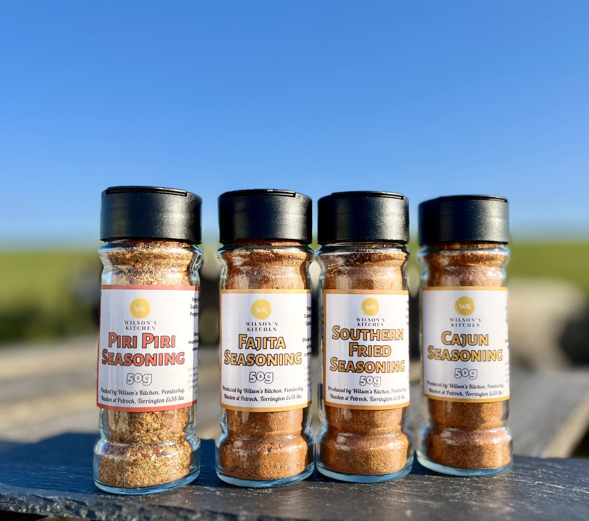 Wilson’s Kitchen Southern Fried Seasoning in a jar, showing a close-up of the flavorful blend of spices for cooking.