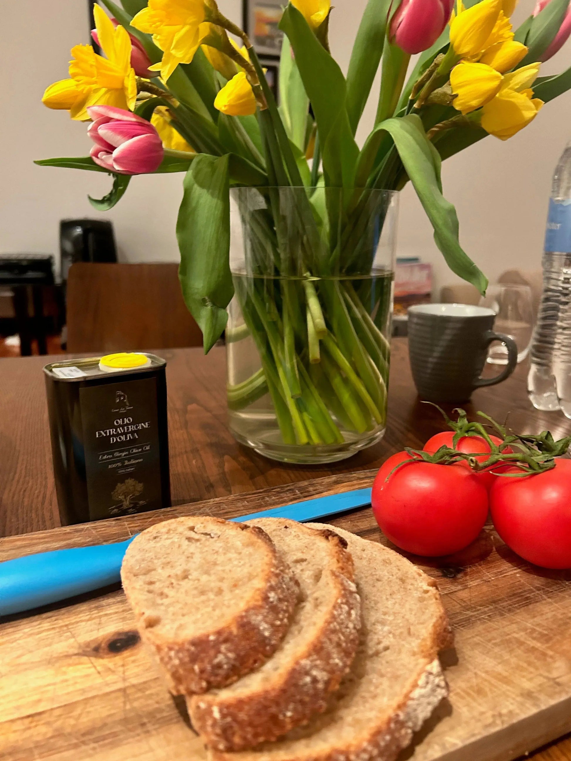Casa La Torre Puglia artisan cold pressed extra virgin olive oil in 250ml bottle, with lush olive trees in the background.