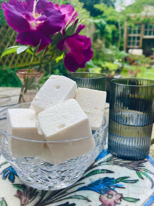 Kensal Sugar Kitchen passionfruit marshmallows with vibrant purple and yellow colors, soft and fluffy texture, and tropical flavor.
