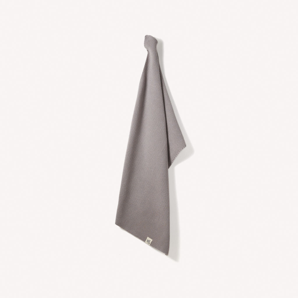 Organic cotton hand towels by Wild and Stone, showcasing soft, absorbent fabric in neutral tones for bathroom or kitchen use.