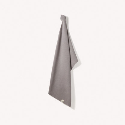Organic cotton hand towels by Wild and Stone, showcasing soft, absorbent fabric in neutral tones for bathroom or kitchen use.
