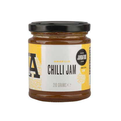 Janda Food Amarillo Chilli Jam in a glass jar with a black lid, featuring a yellow and white label.