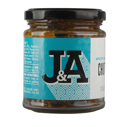 Jar of Janda dried fruit chutney with visible chunks of dried fruits and spices in a glass jar.