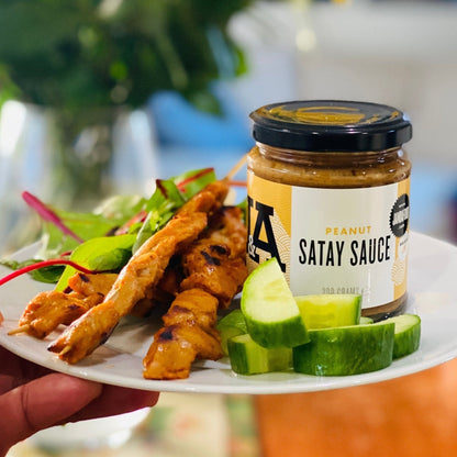 Jar of Janda Food Peanut Satay Sauce showing the label and the creamy peanut satay sauce inside the jar.