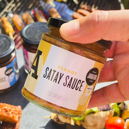 Janda Food Peanut Satay Sauce jar with label, showcasing creamy peanut satay sauce in a glass jar for Asian cuisine.