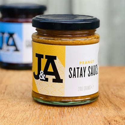 Janda Food Peanut Satay Sauce jar with label, featuring creamy peanut satay sauce in a glass jar with a red lid.