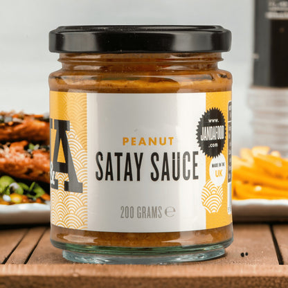 Janda Food Peanut Satay Sauce jar with label, showcasing creamy peanut satay sauce in a glass jar on a white background.