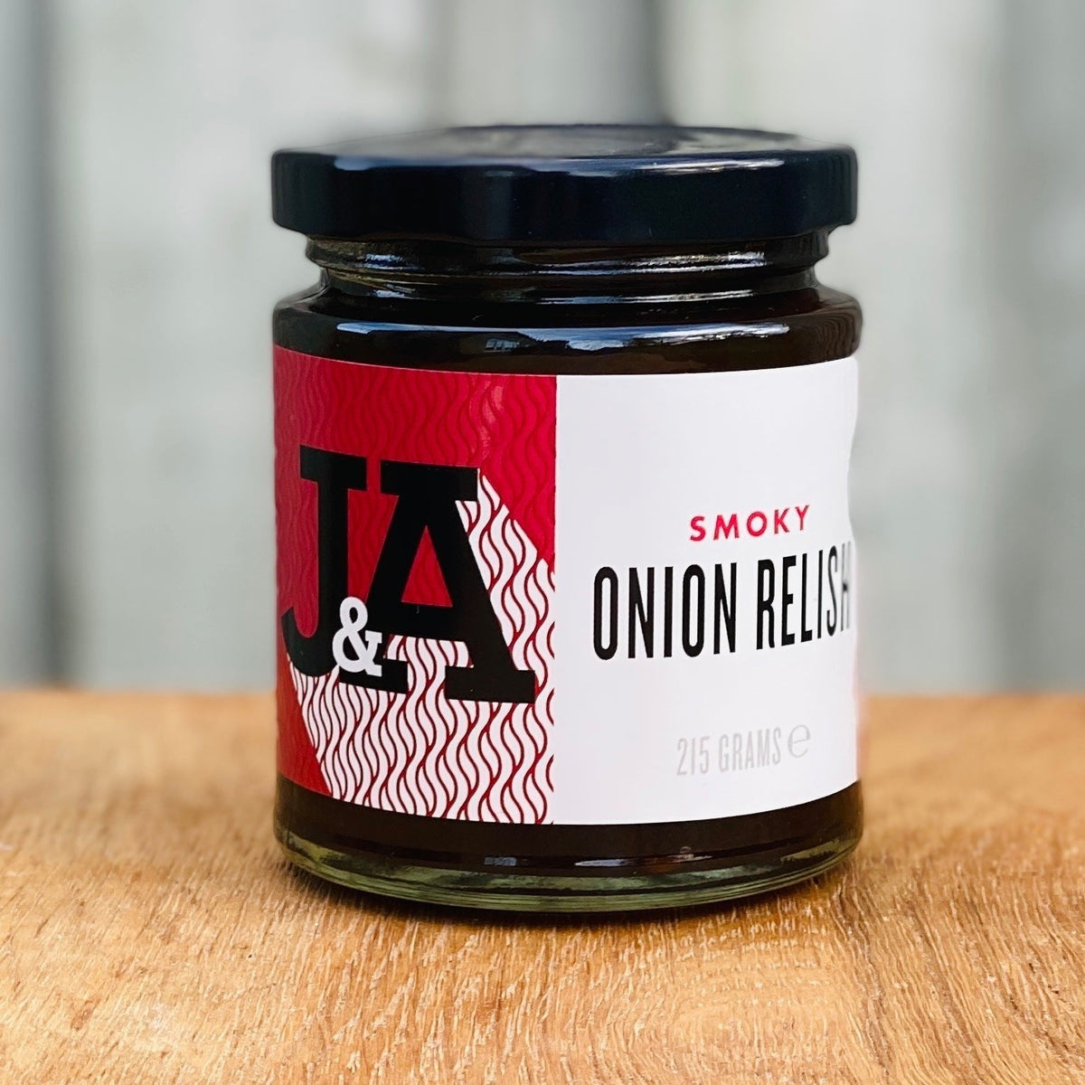 Janda Food Smoky Onion Relish jar, gourmet condiment with smoky onion flavor, ideal for cheese and charcuterie boards.