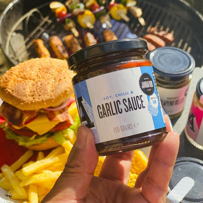 Janda soy, chili, and garlic sauce bottle with label, showcasing the spicy Asian condiment in a glass jar.