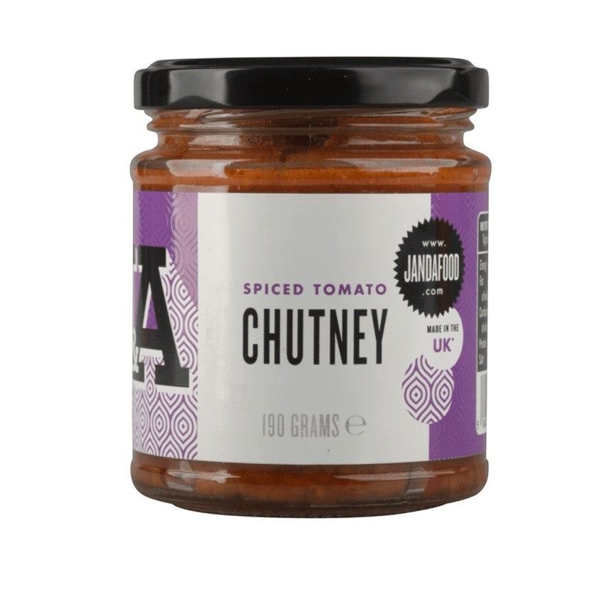 Janda Spiced Tomato Chutney in a glass jar, showcasing its rich, vibrant red color and textured appearance.