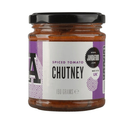 Janda Spiced Tomato Chutney in a glass jar, showcasing its rich, vibrant red color and textured appearance.