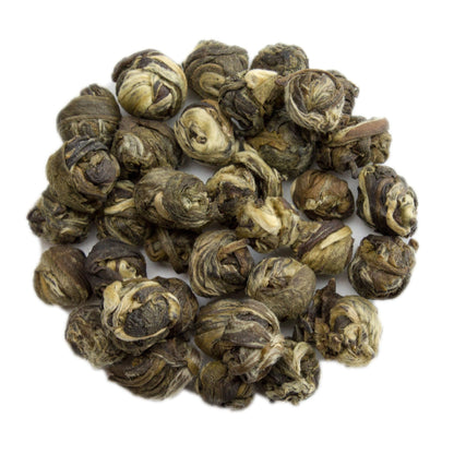 Green tea pearls from PekoeTea Edinburgh, showing delicate jasmine-infused jasmine dragon pearl tea leaves.