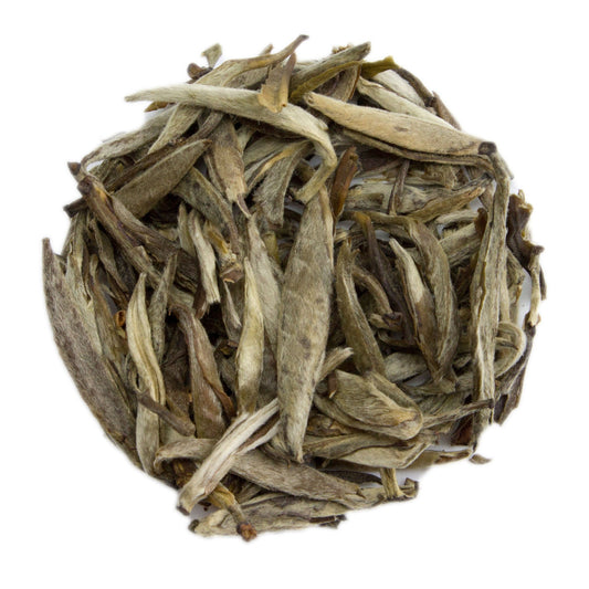Fujian Jasmine Silver Needle White Tea leaves from PekoeTea Edinburgh, showcasing delicate white tea buds with jasmine aroma.