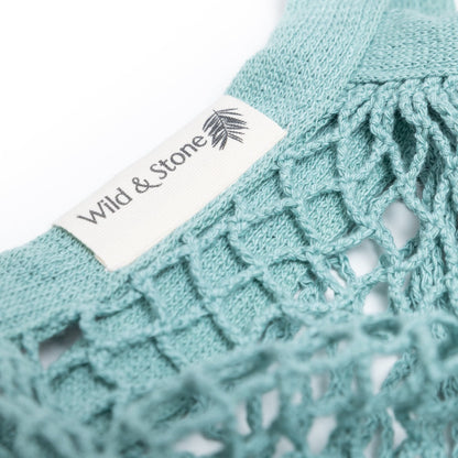 Organic cotton blue crochet tote bag by Wild And Stone, featuring a spacious design and woven texture for casual carrying.
