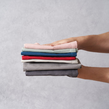 Set of two Wild and Stone organic cotton tea towels with herringbone weave, showcasing soft, durable fabric and classic pattern.