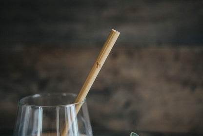 Set of 10 reusable bamboo drinking straws by Wild And Stone, natural eco-friendly straws for beverages in a minimalist design.