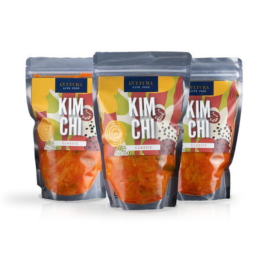 Cultura Live Food Kimchi Bundle 3 Pack featuring jars of traditional fermented Korean kimchi with fresh vegetables and spices.
