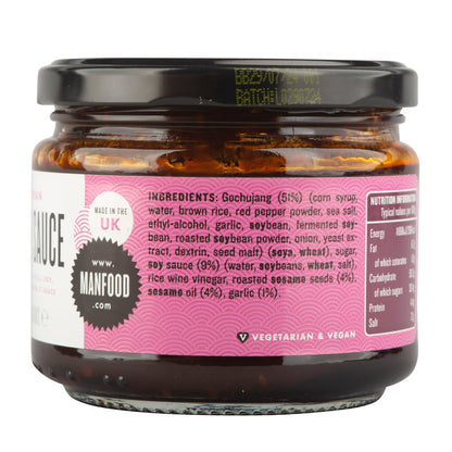 Manfood Korean Taco Sauce bottle with label, showcasing vibrant red sauce in a clear glass container, ready for tacos or dishes.