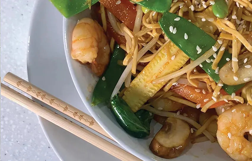 Small bowl of Korean prawns with Taishon vegan sweet and spicy sauce, showcasing a flavorful seafood dish with vibrant sauce.