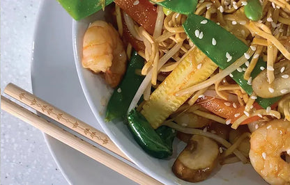 Small bowl of Korean prawns with Taishon vegan sweet and spicy sauce, showcasing a flavorful seafood dish with vibrant sauce.