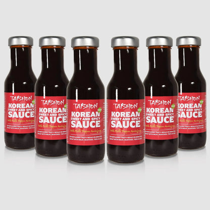 Case of six Taishon Korean sweet and spicy vegan sauce bottles, featuring vibrant labels and sauce inside.